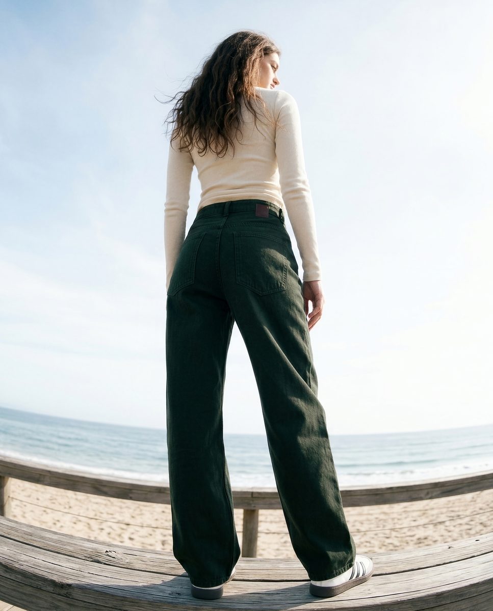 4K AI on-model photo with a fisheye lens look, dark green wide-leg jeans on a coastal boardwalk