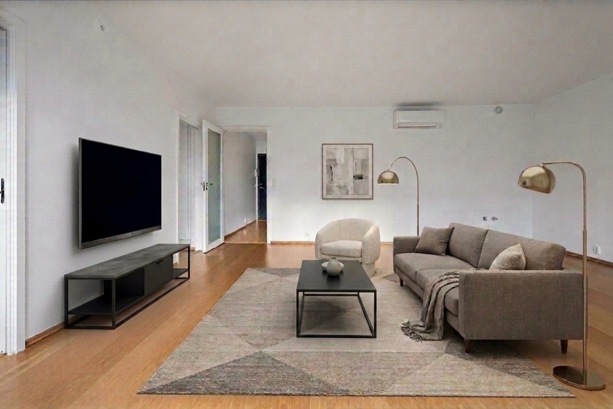 Living room with black TV console and coffee table before revision